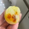 The natural raw mineral white flower cleverly carved and colorful honey wax money bag pendant is approximately 36.6x31.9x29.4mm in size0811790133