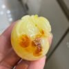 The natural raw mineral white flower cleverly carved and colorful honey wax money bag pendant is approximately 36.6x31.9x29.4mm in size0811790133